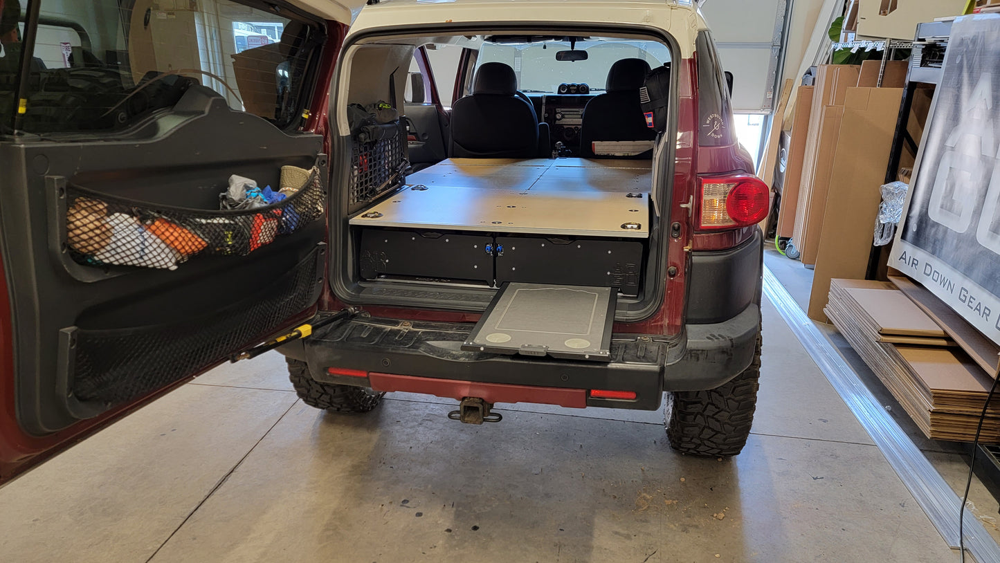 Toyota FJ Cruiser Drawer and sleeping platform for vehicle organization and storage.