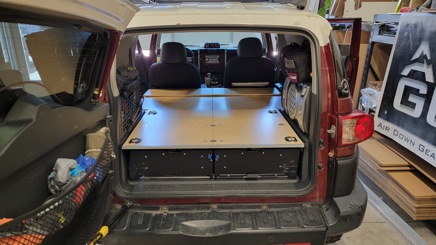 Toyota FJ Cruiser Drawer and sleeping platform for vehicle organization and storage.