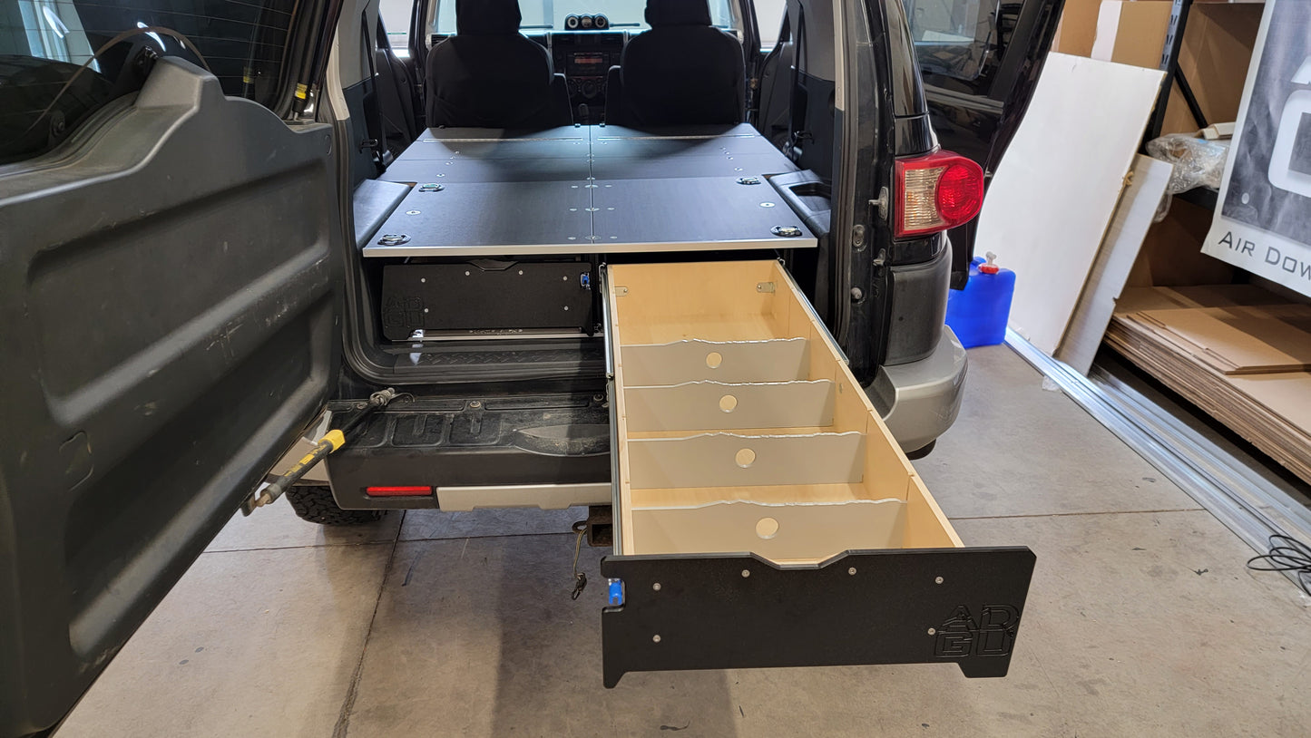 Toyota FJ Cruiser Drawer and sleeping platform for vehicle organization and storage.