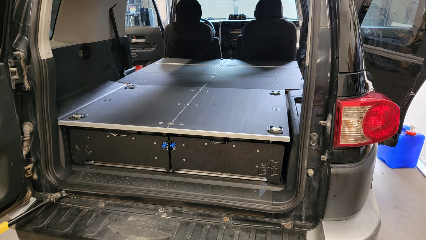 Toyota FJ Cruiser Drawer and sleeping platform for vehicle organization and storage.