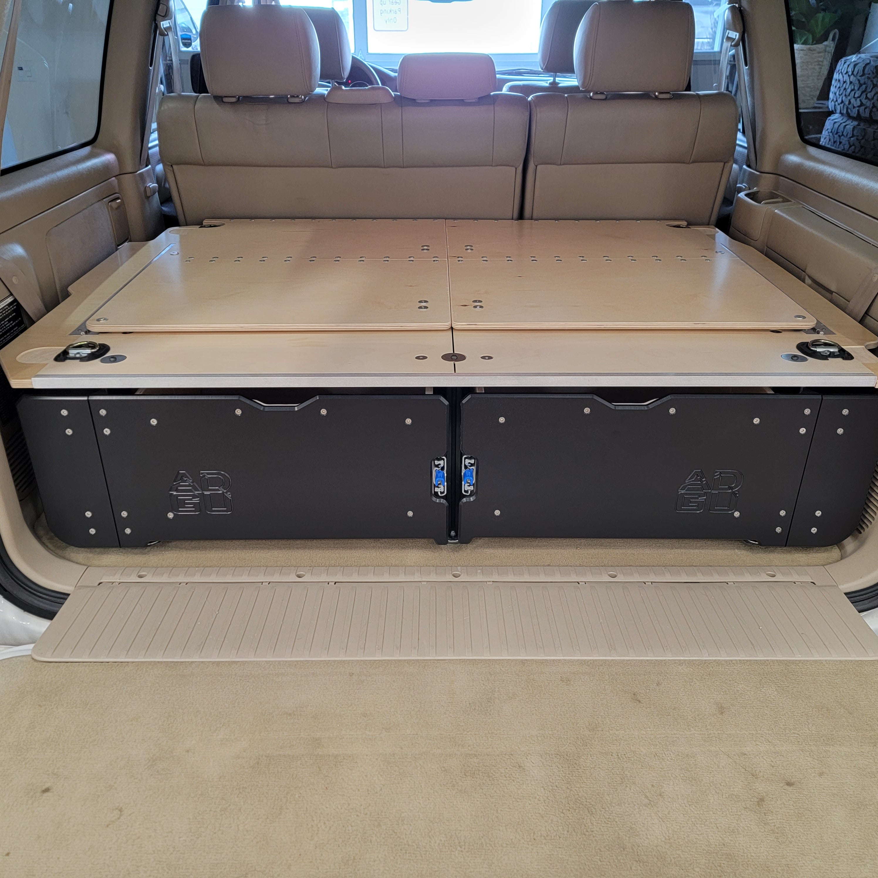 100 Series Toyota Land Cruiser LX470 drawer system with sleeping platform for vehicle organization