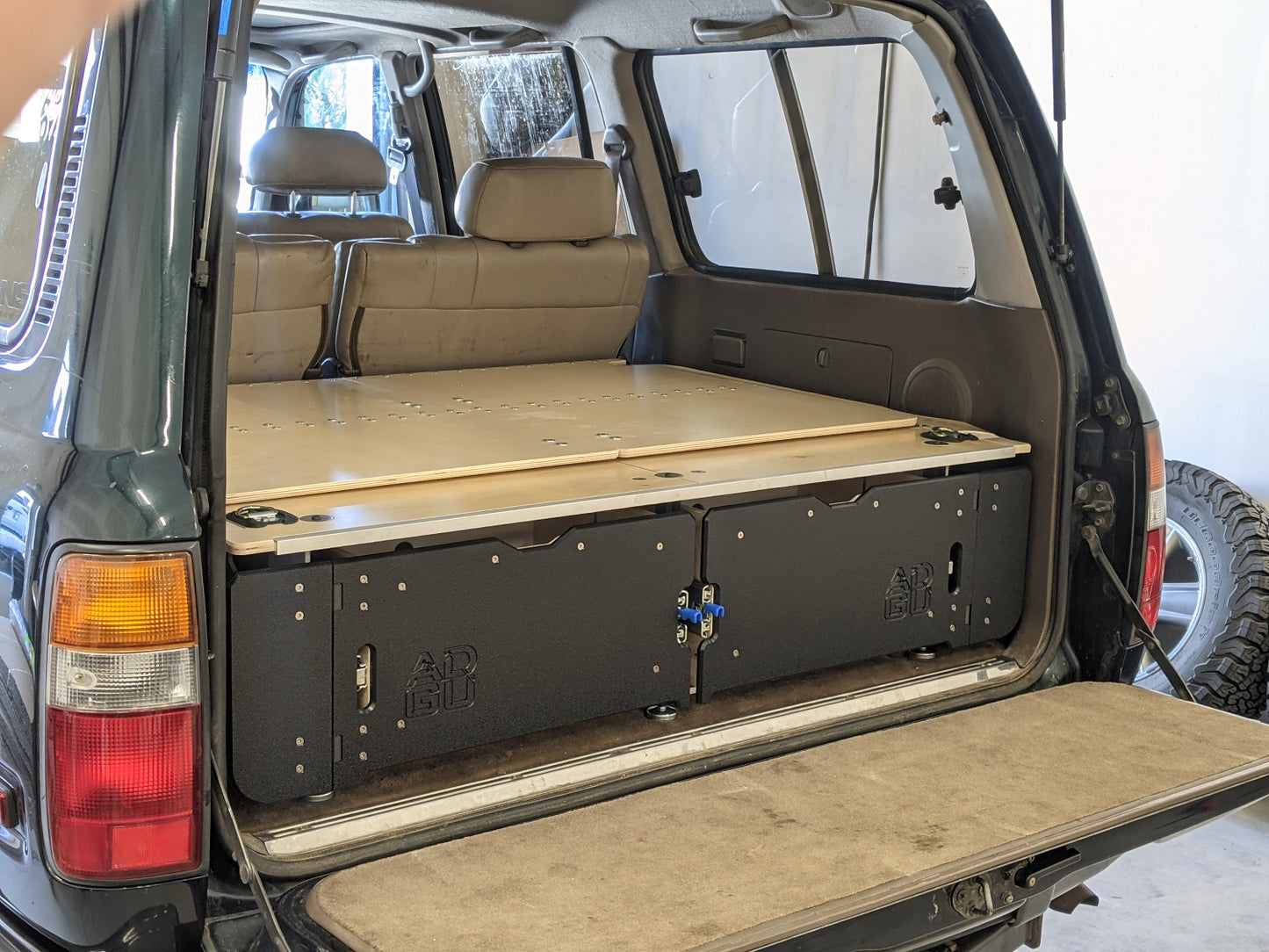 80 Series Toyota Landcruiser drawer system with sleeping platform for vehicle organization